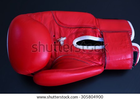 Gold Wedding Rings on Red Boxing Glove. Sport and Family