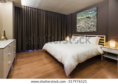 Bedroom interior design. Large bed and Big window with  curtain. Brown Color