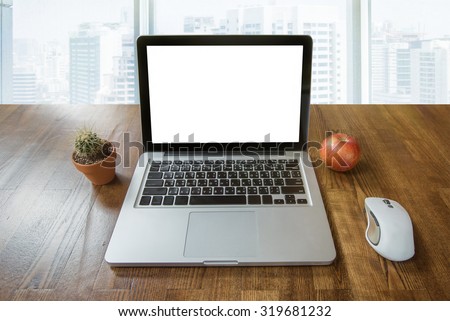 Open Laptop ready for Work on the table against big window on background with nice view to City Business Centre. Education online, Freelance job, good Morning at Home