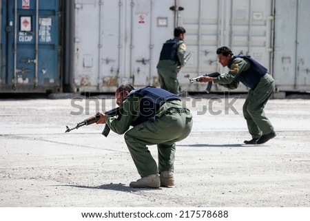 KABUL, AFGHANISTAN - 31 MARCH 2013:  Unidentified body guards practice contact drills at a Private Security Company base on.  Kabul continues to suffer ongoing violence, with regular suicide attacks.
