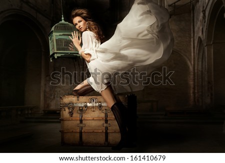Pretty Young Woman With Cage