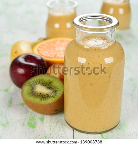 Fruit smoothies on a white table