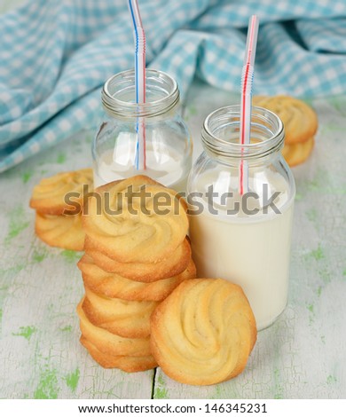 Cookies and milk on a white table