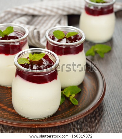 Dessert with cranberry topping on a brown table