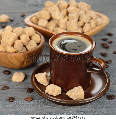 Coffee and brown sugar on a gray background