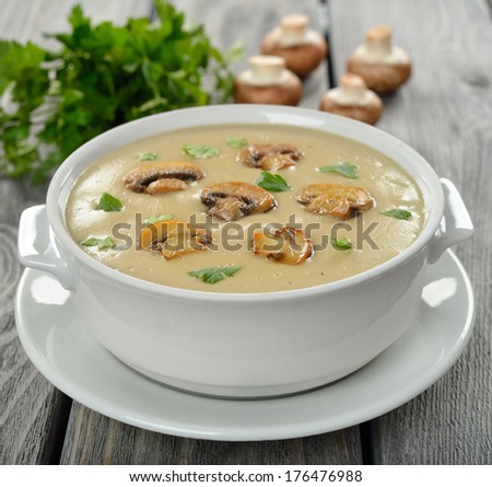 mushroom soup in a white bowl on a gray background