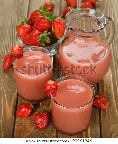 strawberry smoothies on a brown background