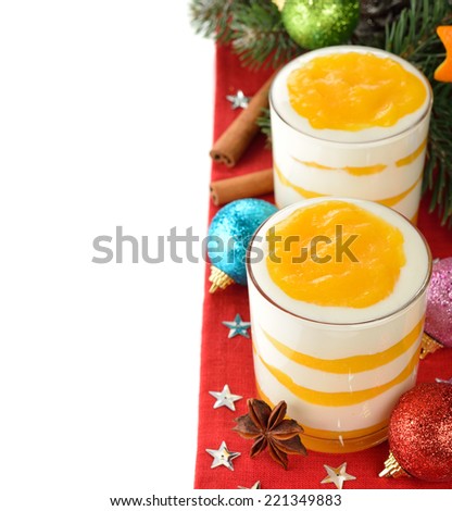 Holiday dessert with orange topping on white background