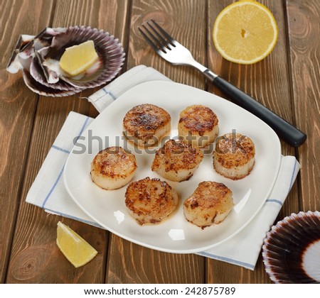 Fried scallops on a white plate