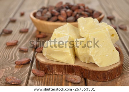 Natural cocoa butter on a brown background