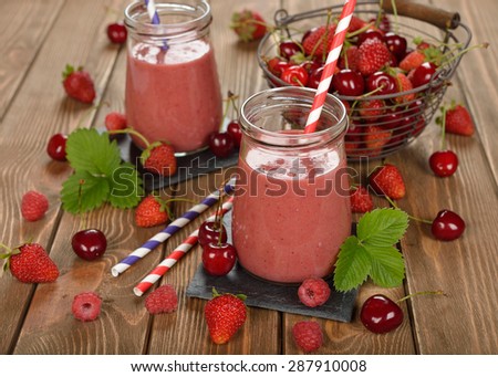 Dietary berry smoothies on a brown background