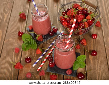 Dietary berry smoothies on a brown background