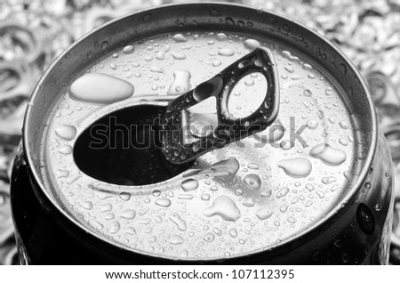 opened aluminum can with water drop