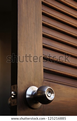 wooden door with grill