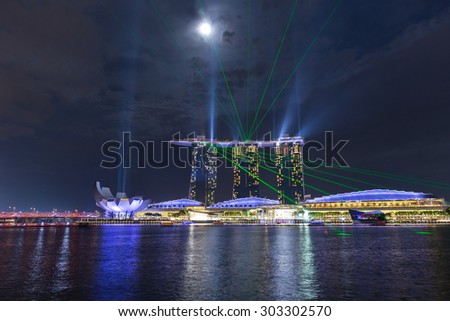 SINGAPORE - JULY 31, Beautiful laser show at Marina Bay Sand on July 31, 2015 in Singapore. Marina Bay Sand is the attraction of Marina Bay.