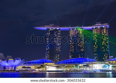 SINGAPORE - JULY 31, Beautiful laser show at Marina Bay Sand on July 31, 2015 in Singapore. Marina Bay Sand is the attraction of Marina Bay.
