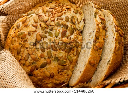 Freshly baked bread with seeds in basket