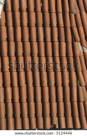 texture of old red tile roof on daylight