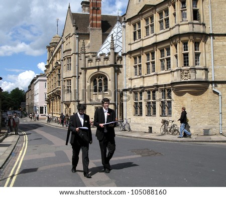 OXFORD - MAY 29:  Graduates of Oxford University walk by Hertford College on May 29, 2007 in Oxford, wearing traditional  academic gowns.