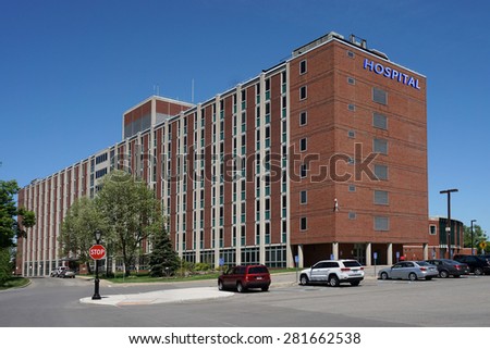 large brick building with hospital sign