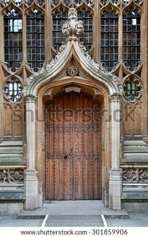 OXFORD, ENGLAND - JULY 2013:  This ornate door was added to the medieval Divinity School in the 1600s, and bears the initials of its famous architect, Christoper Wren, as seen in Oxford in July 2013.