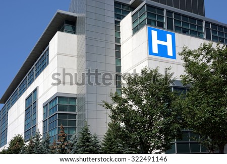modern hospital building surrounded by trees