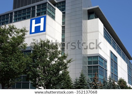 modern hospital building surrounded by trees