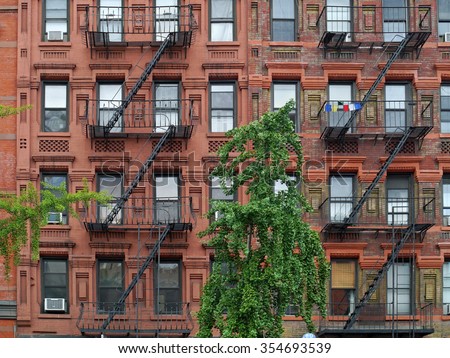 Manhattan upper east side apartment building with steel fire escape ladders