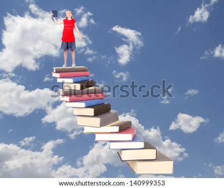 Teen on top of book stair case holding book with clouds as background