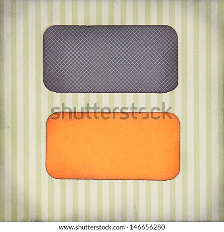 Halloween colored paper tags on paper background for copy space