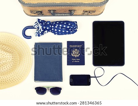 Collection of vacation travel items with a vintage filter