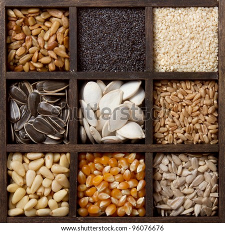 Assorted edible seeds arranged in a printers box