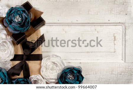 Wrapped vintage packages with vintage flowers against a vintage door