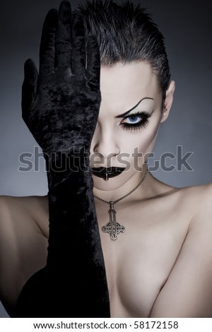 woman portrait with an original  make-up Gothic style, studio shot