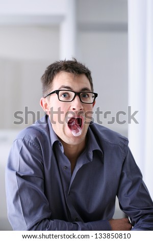 Man in home office with chewing gum