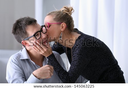 happy young couple kissing in the office