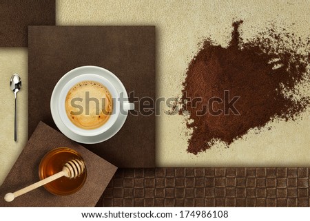cup of coffee with honey and powder tiles composition