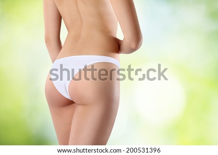 Beautiful body of woman exposing bottom and back side, Isolated on green background