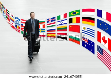 businessman traveling with trolley international flags trip concept