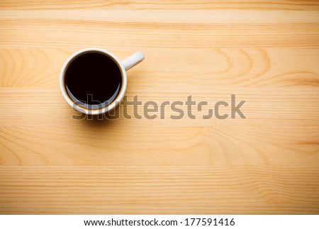 Black Coffee in White Ceramic Cup on Wooden Table