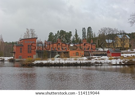 Old paper mill buildings of red brick at winter. Verla Groundwood and Board Mill - Museum. Finland - UNESCO World Heritage.