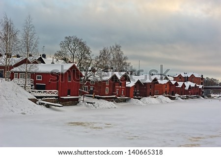 Riverside storage buildings in Old Porvoo at cold winter day