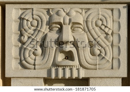 Stone mask - wall fountain on Tampere Theatre