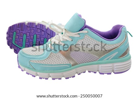 A pair of new girl sport indoor shoes, all logos and markings removed. Studio shot on white, not isolated
