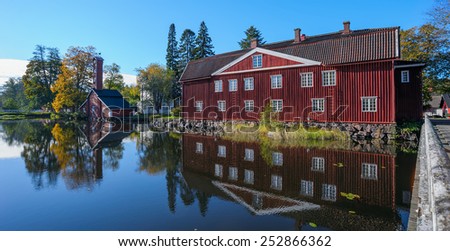 Old factory buildings of traditional red ochre painted wood at Stromfors Iron Works, Finland.  Iron works was founded in 1698. Stromfors Iron Works got its name in 1744.