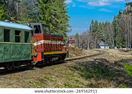 Old narrow-gauge railway. Passenger train with diesel locomotive. Latvia.