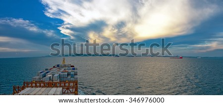 Industrial container ship enters the Laem Chabang bay, view on the bow from the captain bridge. Laem Chabang, Chonburi, Thailand from Gulf of Thailand