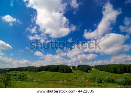 Landscape with green fields and blue sky landscape orientation