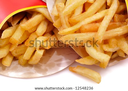 Close-up view to french fries. Shallow depth of field. Not isolated, shot in studio on white.
