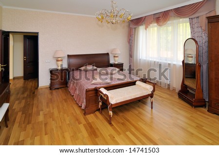 Wide angle view of luxury townhouse bedroom